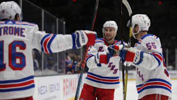 Feb 25, 2020; Uniondale, New York, USA; New York Rangers defenseman Brendan Smith (42) celebrates his goal against the New York Islanders with center Ryan Strome (16) and defenseman Ryan Lindgren (55) during the third period at Nassau Veterans Memorial Coliseum. Mandatory Credit: Brad Penner-USA TODAY Sports