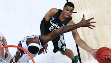 TULSA, OK - MARCH 19: Miles Bridges #22 of the Michigan State Spartans takes a shot against Carlton Bragg Jr. #15 of the Kansas Jayhawks during the second round of the 2017 NCAA Men's Basketball Tournament at BOK Center on March 19, 2017 in Tulsa, Oklahoma. (Photo by Ronald Martinez/Getty Images)