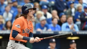 Oct 9, 2015; Kansas City, MO, USA; Houston Astros left fielder Colby Rasmus hits a RBI double against the Kansas City Royals in the first inning in game two of the ALDS at Kauffman Stadium. Mandatory Credit: Peter G. Aiken-USA TODAY Sports