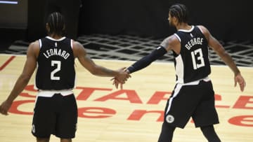 Jun 12, 2021; Los Angeles, California, USA; LA Clippers guard Paul George (13) celebrates with forward Kawhi Leonard (2) against the Utah Jazz in the fourth quarter during game three in the second round of the 2021 NBA Playoffs. at Staples Center. Mandatory Credit: Kelvin Kuo-USA TODAY Sports