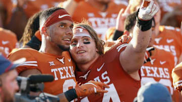AUSTIN, TX - OCTOBER 13: Collin Johnson #9 of the Texas Longhorns and Breckyn Hager #44 celebrate after the game against the Baylor Bears at Darrell K Royal-Texas Memorial Stadium on October 13, 2018 in Austin, Texas. (Photo by Tim Warner/Getty Images)