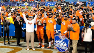 Dec 5, 2015; Charlotte, NC, USA; Clemson Tigers head coach Dabo Swinney (L) holds up the trophy for fans after winning the ACC football championship game at Bank of America Stadium. The Tigers won 45-37. Mandatory Credit: Jim Dedmon-USA TODAY Sports