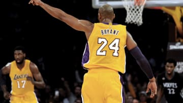 LOS ANGELES, CA - JANUARY 26: Los Angeles Lakers forward Kobe Bryant (24) points after hitting a three point shot against Andrew Wiggins and the Minnesota Timberwolves. (Photo by Keith Birmingham, Pasadena Star-News/SCNG)
