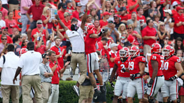 Jermaine Burton celebrates after a touchdown catch with wide receiver coach Cortez Hankton. (Photo by Brett Davis/Getty Images)