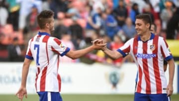 July 27, 2014; San Francisco, CA, USA; Atletico Madrid player Saul (7) is congratulated by player Guillherme Siqueira (3, right) after Saul made the game-winning shootout goal during the match against the San Jose Earthquakes at Candlestick Park. Atletico Madrid defeated the Earthquakes 4-3 in a shootout. Mandatory Credit: Kyle Terada-USA TODAY Sports