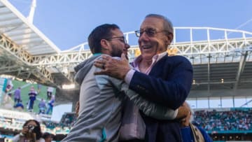 Miami Dolphins head coach Mike McDaniel embraces Dolphins owner Stephen Ross after the Dolphins beat the New York Jets at Hard Rock Stadium on Sunday, January 8, 2023, in Miami Gardens, FL.