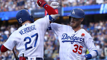 LOS ANGELES, CALIFORNIA - MAY 27: Cody Bellinger #35 of the Los Angeles Dodgers celebrates with teammate Alex Verdugo #27 after Bellinger hit a solo home run to right field in the third inning of the MLB game against the New York Mets at Dodger Stadium on May 27, 2019 in Los Angeles, California. (Photo by Victor Decolongon/Getty Images)