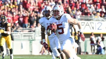 Jan 1, 2016; Pasadena, CA, USA; Stanford Cardinal running back Christian McCaffrey (5) runs for a touchdown against the Iowa Hawkeyes during the second quarter in the 2016 Rose Bowl at Rose Bowl. Mandatory Credit: Robert Hanashiro-USA TODAY Sports