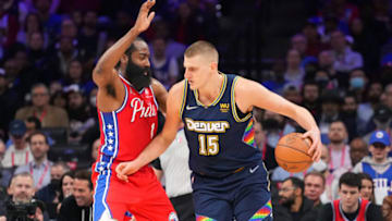 Denver Nuggets star Nikola Jokic is defended by James Harden of the Philadelphia 76ers. (Photo by Mitchell Leff/Getty Images)