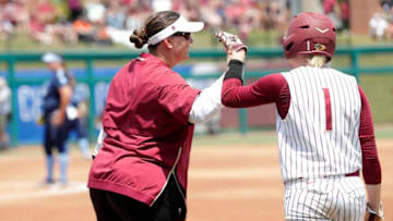 Florida State Seminoles infielder Dani Morgan (1) high fives head coach Lonni Alameda. The Florida State Seminoles host the UNC Tar Heels for the ACC Softball Tournament finals Saturday, May 11, 2019.Fsu V Unc Acc Softball203
