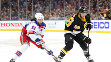 BOSTON, MASSACHUSETTS - NOVEMBER 29: Mika Zibanejad #93 of the New York Rangers defends David Pastrnak #88 of the Boston Bruins during the first period at TD Garden on November 29, 2019 in Boston, Massachusetts. (Photo by Maddie Meyer/Getty Images)