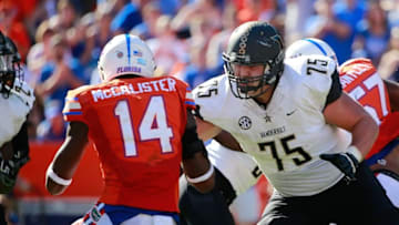 Nov 7, 2015; Gainesville, FL, USA; Vanderbilt Commodores offensive lineman Bailey Granier (75) blocks Florida Gators defensive lineman Alex McCalister (14) during the second half at Ben Hill Griffin Stadium. Florida Gators defeated the Vanderbilt Commodores 9-7. Mandatory Credit: Kim Klement-USA TODAY Sports