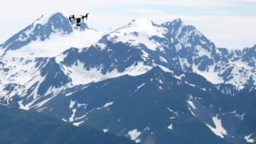 SEWARD, AK - JULY 04: A drone flies during the Men's Division of the 91st Running of the Mount Marathon Race at Mount Marathon on July 4, 2018 in Seward, Alaska. The Mount Marathon Race is held every year on July 4th and the approximate race distance is 3.1 miles (no set route on the mountain). Runners begin in downtown Seward and must pass the top of Mount Marathon (elevation gain of 3,022 feet) and return to the downtown finish line. (Photo by Lance King/Getty Images)