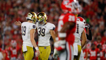 ATHENS, GEORGIA - SEPTEMBER 21: Jonathan Doerer #39 of the Notre Dame Fighting Irish celebrates his second quarter field goal with Jay Bramblett #19 while playing the Georgia Bulldogs at Sanford Stadium on September 21, 2019 in Athens, Georgia. (Photo by Kevin C. Cox/Getty Images)