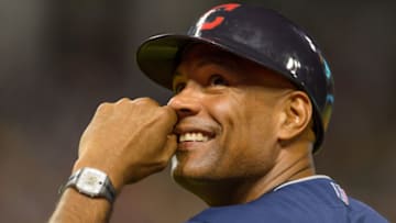CLEVELAND, OH - AUGUST 13: First base coach Sandy Alomar Jr. #15 of the Cleveland Indians laughs at the fans during the sixth inning against the Arizona Diamondbacks at Progressive Field during the second game of a double header on August 13, 2014 in Cleveland, Ohio. (Photo by Jason Miller/Getty Images)
