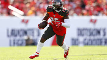 TAMPA, FLORIDA - DECEMBER 29: Peyton Barber #25 of the Tampa Bay Buccaneers runs with the ball against the Atlanta Falcons during the first half at Raymond James Stadium on December 29, 2019 in Tampa, Florida. (Photo by Michael Reaves/Getty Images)