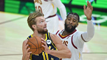 Dec 14, 2020; Cleveland, Ohio, USA; Indiana Pacers forward Domantas Sabonis (11) goes to the basket against Cleveland Cavaliers center Andre Drummond (3) during the first quarter at Rocket Mortgage FieldHouse. Mandatory Credit: David Dermer-USA TODAY Sports