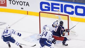 Pierre-Luc Dubois #18 of the Columbus Blue Jackets scores the game-winning goal past Frederik Andersen #31 of the Toronto Maple Leafs. (Photo by Andre Ringuette/Freestyle Photo/Getty Images)