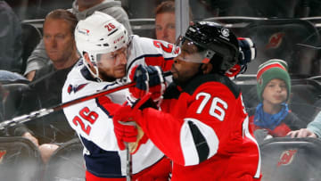 NEWARK, NEW JERSEY - OCTOBER 04: Nic Dowd #26 of the Washington Capitals gets the stick up on P.K. Subban #76 of the New Jersey Devils during the first period in a preseason game at the Prudential Center on October 04, 2021 in Newark, New Jersey. (Photo by Bruce Bennett/Getty Images)