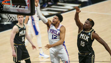 Jun 14, 2021; Atlanta, Georgia, USA; Philadelphia 76ers forward Tobias Harris (12) shoots past Atlanta Hawks center Clint Capela (15) in the first quarter during game four in the second round of the 2021 NBA Playoffs at State Farm Arena. Mandatory Credit: Brett Davis-USA TODAY Sports