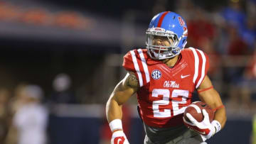 Sep 27, 2014; Oxford, MS, USA; Mississippi Rebels running back Jordan Wilkins (22) advances the ball during the game against the Memphis Tigers at Vaught-Hemingway Stadium. Mandatory Credit: Spruce Derden-USA TODAY Sports