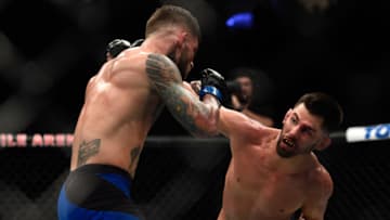 LAS VEGAS, NV - DECEMBER 30: (R-L) Dominick Cruz punches Cody Garbrandt in their UFC bantamweight championship bout during the UFC 207 event at T-Mobile Arena on December 30, 2016 in Las Vegas, Nevada. (Photo by Brandon Magnus/Zuffa LLC/Zuffa LLC via Getty Images)