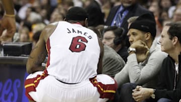 LeBron James #6 of the Miami Heat talks with Maverick Carter while playing the Cleveland Cavaliers (Photo by Gregory Shamus/Getty Images)