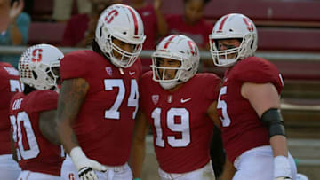 PALO ALTO, CA - OCTOBER 27: JJ Arcega-Whiteside #19 of the Stanford Cardinal is congratulated by Bryce Love #20, Devery Hamilton #74 and Connor Wedington #5 after Arcega-Whiteside caught a touchdown pass against the Washington State Cougars during the first half of their NCAA football game at Stanford Stadium on October 27, 2018 in Palo Alto, California. (Photo by Thearon W. Henderson/Getty Images)