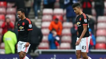 SUNDERLAND, ENGLAND - FEBRUARY 13: Memphis Depay (L) and Cameron Borthwick-Jackson (R) of Manchester United leave the pitch after their 1-2 defeat in the Barclays Premier League match between Sunderland and Manchester United at the Stadium of Light on February 13, 2016 in Sunderland, England. (Photo by Clive Brunskill/Getty Images)