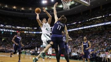 Apr 11, 2014; Boston, MA, USA; Boston Celtics center Kris Humphries (43) drives the ball against Charlotte Bobcats forward Josh McRoberts (11) in the second half at TD Garden. The Celtics defeated the Bobcats 106-103. Mandatory Credit: David Butler II-USA TODAY Sports