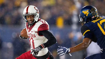 Nov 19, 2016; Morgantown, WV, USA; Oklahoma Sooners wide receiver Dede Westbrook (11) runs the ball during the first quarter against the West Virginia Mountaineers at Milan Puskar Stadium. Mandatory Credit: Ben Queen-USA TODAY Sports