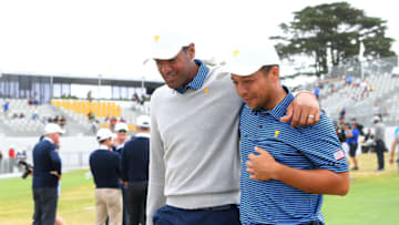 MELBOURNE, AUSTRALIA - DECEMBER 13: Tony Finau of the United States team and Xander Schauffele of the United States team walk during Friday foursome matches on day two of the 2019 Presidents Cup at Royal Melbourne Golf Course on December 13, 2019 in Melbourne, Australia. (Photo by Quinn Rooney/Getty Images)