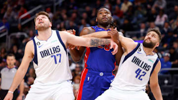Dallas Mavericks guard Luka Doncic (77) and forward Maxi Kleber (42) box out Detroit Pistons center Isaiah Stewart Credit: Rick Osentoski-USA TODAY Sports