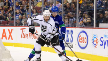 VANCOUVER, BC - MARCH 28: Los Angeles Kings Defenceman Alec Martinez (27) is checked by Vancouver Canucks Center Elias Pettersson (40) during their NHL game at Rogers Arena on March 28, 2019 in Vancouver, British Columbia, Canada. Vancouver won 3-2 (Photo by Derek Cain/Icon Sportswire via Getty Images)