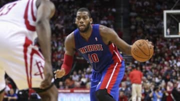 Mar 1, 2014; Houston, TX, USA; Detroit Pistons power forward Greg Monroe (10) controls the ball during the third quarter against the Houston Rockets at Toyota Center. Mandatory Credit: Troy Taormina-USA TODAY Sports