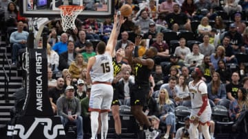 SALT LAKE CITY UT- APRIL 8: Nikola Jokic #15 of the Denver Nuggets swats the ball away from Luka Samanic #19 of the Utah Jazz as Kris Dunn #11 defends during the first half of their game on April 8, 2023 at the Vivint Arena in Salt Lake City, Utah. NOTE TO USER: User expressly acknowledges and agrees that, by downloading and using this photograph, User is consenting to the terms and conditions of the Getty Images License Agreement(Photo by Chris Gardner/ Getty Images)