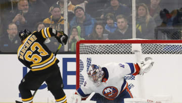 Dec 19, 2019; Boston, MA, USA; New York Islanders goaltender Semyon Varlamov (40) makes a save against Boston Bruins left wing Brad Marchand (63) during a shootout at TD Garden. Mandatory Credit: Winslow Townson-USA TODAY Sports