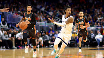 ORLANDO, FLORIDA - FEBRUARY 05: Ja Morant #12 of the Memphis Grizzlies passes during a game against the Orlando Magic at Amway Center on February 05, 2022 in Orlando, Florida. (Photo by Mike Ehrmann/Getty Images)