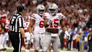 Jan 1, 2015; New Orleans, LA, USA; Ohio State Buckeyes wide receiver Evan Spencer (6) and running back Ezekiel Elliott (15) react following Elliot