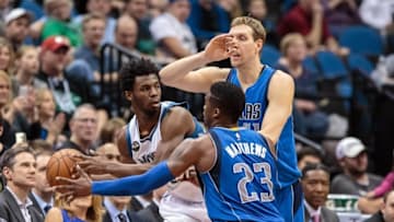 Apr 3, 2016; Minneapolis, MN, USA; Dallas Mavericks guard Wesley Matthews (23) and forward Dirk Nowitzki (41) defend against Minnesota Timberwolves forward Andrew Wiggins (22) in the second quarter at Target Center. Mandatory Credit: Brad Rempel-USA TODAY Sports