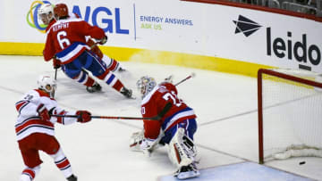 WASHINGTON, DC - DECEMBER 27: Washington Capitals goaltender Braden Holtby (70) gives up a third period goal on a rebound to Carolina Hurricanes center Sebastian Aho (20) on December 27, 2018, at the Capital One Arena in Washington, D.C. (Photo by Mark Goldman/Icon Sportswire via Getty Images)