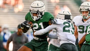 Michigan State's Davion Primm, left, runs the ball as A.J. Kirk closes in during the Meet the Spartans open practice on Monday, Aug. 23, 2021, at Spartan Stadium in East Lansing.210823 Meet The Spartans Football 192a