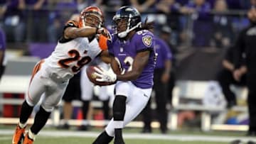 September 10, 2012; Baltimore, MD, USA; Baltimore Ravens wide receiver Torrey Smith (82) catches a long pass over Cincinnati Bengals cornerback Leon Hall (29) at M