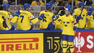 Sweden's forward Rasmus Asplund celebrates a goal with his teammates during the 2022 IIHF Ice Hockey World Championships preliminary round group B match between Czech Republic and Sweden in Tampere on May 15, 2022. - - Finland OUT (Photo by Vesa Moilanen / Lehtikuva / AFP) / Finland OUT (Photo by VESA MOILANEN/Lehtikuva/AFP via Getty Images)