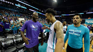 Charlotte Hornets owner Michael Jordan congratulates guard Courtney Lee (1) after the team defeated the Miami Heat on Monday, April 25, 2016, at Time Warner Cable Arena in Charlotte, N.C. (David T. Foster III/Charlotte Observer/TNS via Getty Images)
