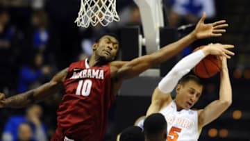 Mar 12, 2015; Nashville, TN, USA; Alabama Crimson Tide forward Jimmie Taylor (10) battles for a rebound with Florida Gators center John Egbunu (5) during the second half of the second round in the SEC Conference Tournament at Bridgestone Arena. Florida won 69-61. Mandatory Credit: Christopher Hanewinckel-USA TODAY SportsMar 12, 2015; Nashville, TN, USA; during the second half of the second round against the Alabama Crimson Tide in the SEC Conference Tournament at Bridgestone Arena. Florida won 69-61. Mandatory Credit: Christopher Hanewinckel-USA TODAY Sports