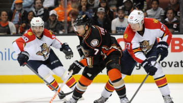 November 4, 2015; Anaheim, CA, USA; Anaheim Ducks center Andrew Cogliano (7) controls the puck against Florida Panthers center Nick Bjugstad (27) and right wing Jaromir Jagr (68) during the second period at Honda Center. Mandatory Credit: Gary A. Vasquez-USA TODAY Sports