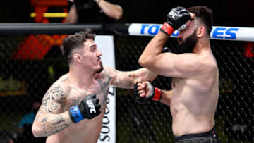 LAS VEGAS, NEVADA - FEBRUARY 20: In this UFC handout, (L-R) Tom Aspinall of England punches Andrei Arlovski of Belarus in a heavyweight bout during the UFC Fight Night event at UFC APEX on February 20, 2021 in Las Vegas, Nevada. (Photo by Chris Unger/Zuffa LLC via Getty Images)
