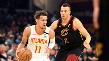 CLEVELAND, OHIO - FEBRUARY 12: Trae Young #11 of the Atlanta Hawks drives around Dante Exum #1 of the Cleveland Cavaliers during the first half at Rocket Mortgage Fieldhouse on February 12, 2020 in Cleveland, Ohio. NOTE TO USER: User expressly acknowledges and agrees that, by downloading and/or using this photograph, user is consenting to the terms and conditions of the Getty Images License Agreement. (Photo by Jason Miller/Getty Images)