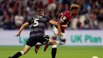 LONDON, ENGLAND - SEPTEMBER 26: Fiacre Kelleher of Macclesfield Town tackles Grady Diangana of West Ham United during the Carabao Cup Third Round match between West Ham United and Macclesfield Town at The London Stadium on September 26, 2018 in London, England. (Photo by Warren Little/Getty Images)